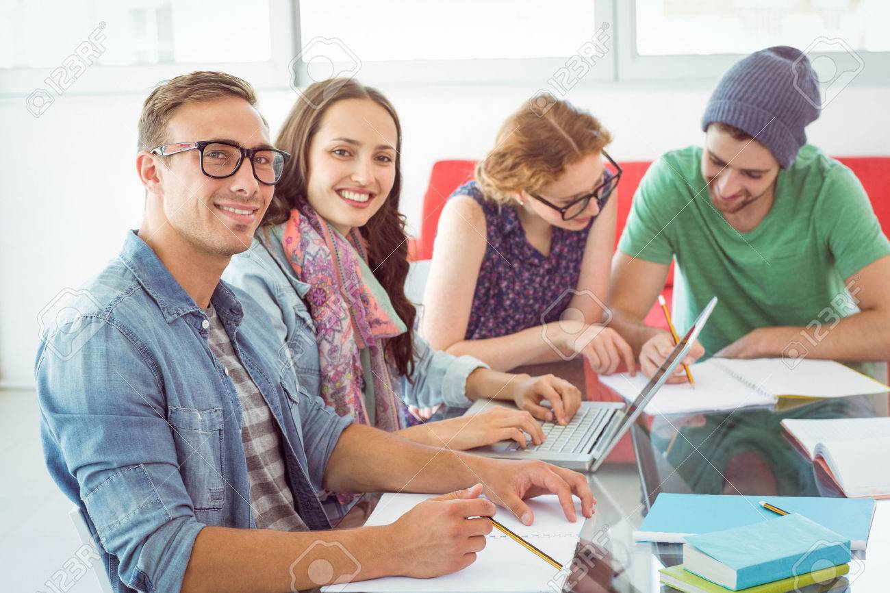 38106107-fashion-students-working-as-a-team-at-the-college